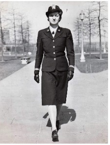 Photo of Violet Boynton in uniform, walking outdoors toward the camera.