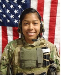 Photo of Jennifer Moreno in uniform standing in front of an American flag