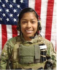 Photo of Jennifer Moreno in uniform standing in front of an American flag